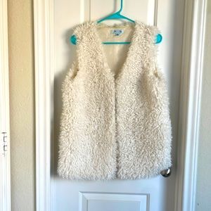 Cream colored furry vest